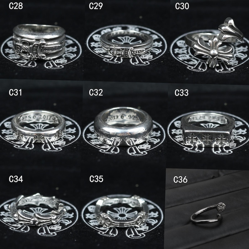 Puede incluir: Una colecci&oacute;n de nueve anillos de plata etiquetados del C28 al C36, con varios dise&ntilde;os intrincados que incluyen motivos de cruz, bandas grabadas y estilos abiertos. Cada anillo se muestra individualmente sobre una superficie negra con logo.
