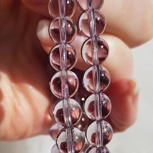 Pulseiras deslumbrantes de ametista boliviana: Pulseiras de cristal natural AAA de qualidade superior e transparência cristalina.