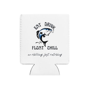 May include: White drink koozie with a black and blue fish graphic. The text on the koozie reads "EAT DRINK FLOAT CHILL" with the tagline "no chilling...just catching."