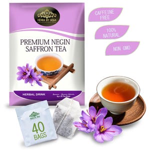 Könnte beinhalten: Eine Packung Premium Negin Safran-Tee mit einer Tasse Tee, Safranblüten und Teebeuteln. Die Verpackung ist lila und weiß mit dem Text "Premium Negin Safran-Tee". Der Tee ist als koffeinfrei, 100% natürlich und gentechnikfrei gekennzeichnet.