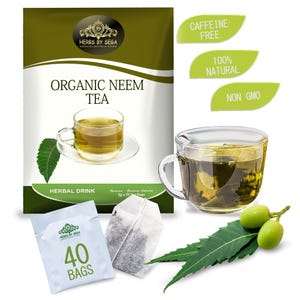 Peut inclure: Image de thé de neem biologique, avec une tasse en verre transparente remplie de thé, un sachet de thé et un paquet de 40 sachets. Des feuilles et des fruits de neem frais sont également présents. Le texte indique que le thé est sans caféine, 100% naturel et sans OGM.