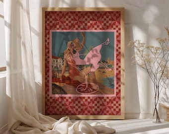 May include: A framed art print featuring a woman in a pink dress inside a cocktail glass. The artwork has a pink and red checkered border and a beach scene background. The frame is made of wood.