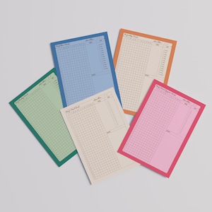 May include: A collection of colorful, grid-lined notepads in shades of blue, orange, pink, green, and beige. Each notepad has a colored border and a section for notes. The text "Self-Care Tracking Tracker" is visible at the top of each notepad.