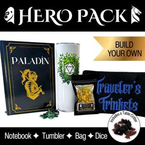 May include: A Hero Pack set featuring a black notebook with a gold paladin illustration, a white tumbler with a green leaf and d20 graphic, a black pouch labeled Traveler's Trinkets, a bag of yellow dice, and a small green dragon figurine.