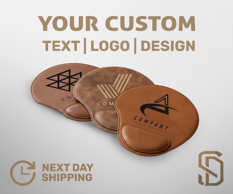 May include: Three brown ergonomic mouse pads with custom logo designs. The pads have a wrist rest and are in shades of brown. The text "YOUR CUSTOM TEXT | LOGO | DESIGN" is at the top.