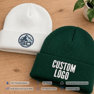 May include: A white knit beanie featuring a circular embroidered mountain logo with the text SO, and a dark green knit beanie with the white embroidered text CUSTOM LOGO. Both beanies have a folded cuff and a textured knit construction.