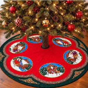 May include: A circular red Christmas tree skirt featuring a dark green scalloped border with gold filigree accents. The skirt displays five circular patches depicting Santa Claus in a sleigh pulled by reindeer against a snowy landscape.