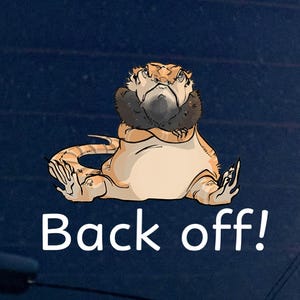 May include: A cartoon illustration of a bearded dragon with an angry expression. The lizard is tan and cream-coloured, with a black beard and the text "Back off!" in white.
