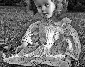 The Dreamer, creepy black and white doll art, abandoned toy, vintage doll art photo