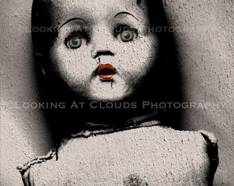 scary black and white creepy doll photo, old doll body with piercing blue eyes, edgy outsider art, spooky Halloween decor