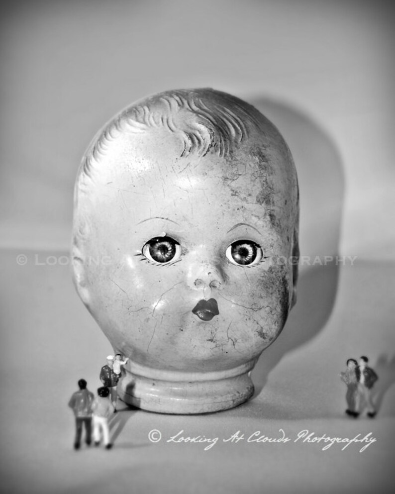 unusual doll head on display art photo, creepy doll with miniatures, funky art photography, weird doll decor image 1