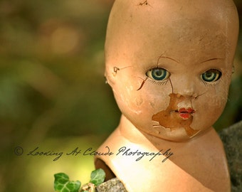 blue eyed doll head photo, vintage doll art, beautifully creepy doll with cracks and chips