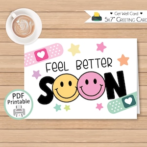 May include: A white 5x7 inch greeting card with the words "Feel Better Soon" and two smiley faces. The card has a pink bandage with a heart, stars, and a PDF printable icon.
