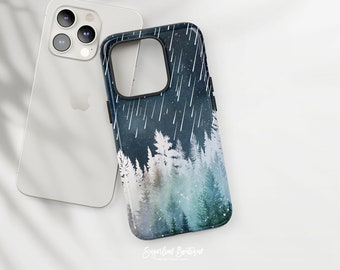 May include: A black phone case with a watercolor design of a forest with falling snow and stars. The design is in shades of blue, green, and white.