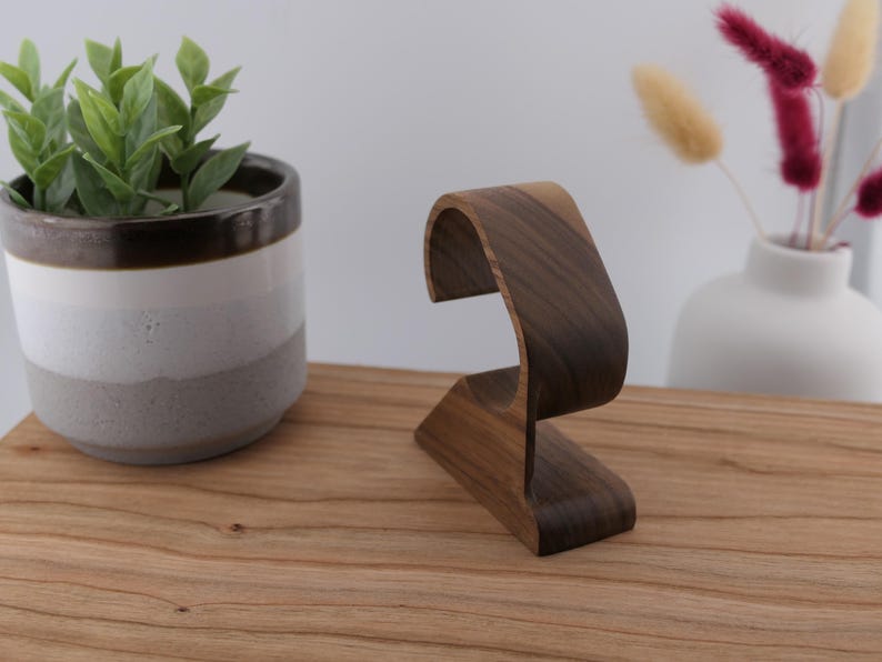 May include: A set of three ceramic mugs with a speckled, matte finish in cream, light grey, and dark grey. Each mug has a simple, minimalist design, ideal for coffee or tea.