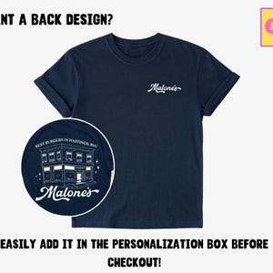 May include: A navy blue t-shirt featuring the white text Malone's on the left chest. A circular inset shows a white line drawing of a building with the text Best Burgers in Hastings, MA and Malone's. The text WANT A BACK DESIGN? is at the top.