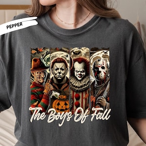 Get ready for spooky season with this “The Boys of Fall” horror movie shirt featuring four of the most iconic scary movie villains — Freddy Krueger, Michael Myers, Pennywise, and Jason Voorhees 🔪🎈. Perfect for horror fans, this graphic tee combines creepy Halloween vibes with fall colors, making it a must-have for scary movie marathons, haunted houses, and October nights. Soft, comfortable, and ideal for any horror lover’s fall wardrobe.