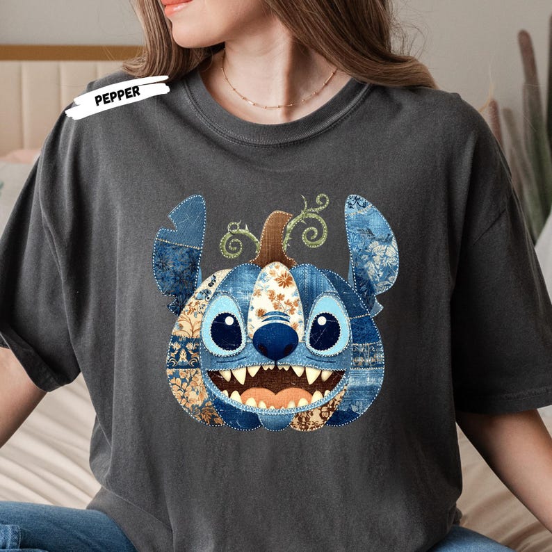🎃 Cozy Disney Halloween Sweatshirt – Patchwork Stitch Pumpkin Pullover
Celebrate spooky season in magical style with this adorable Stitch pumpkin sweatshirt, featuring a patchwork pumpkin design in rich denim and floral patterns. Perfect for Disney Halloween outfits, fall trips to the parks, or cozy autumn nights. This unisex crewneck makes the ultimate gift for Disney lovers, pumpkin spice fans, and anyone who loves cute and spooky fashion. Soft, comfortable, and perfect for Halloween parties