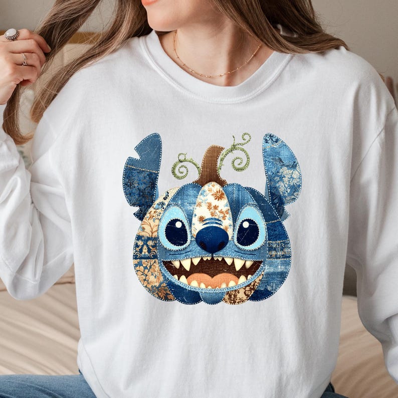 🎃 Cozy Disney Halloween Sweatshirt – Patchwork Stitch Pumpkin Pullover
Celebrate spooky season in magical style with this adorable Stitch pumpkin sweatshirt, featuring a patchwork pumpkin design in rich denim and floral patterns. Perfect for Disney Halloween outfits, fall trips to the parks, or cozy autumn nights. This unisex crewneck makes the ultimate gift for Disney lovers, pumpkin spice fans, and anyone who loves cute and spooky fashion. Soft, comfortable, and perfect for Halloween parties