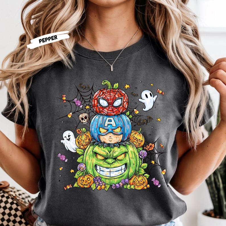 Get ready to turn heads this Halloween with our Stacked Superhero Pumpkin Shirt! 🎃💥 This fun and spooky fall tee features your favorite Marvel-inspired heroes — Spider-Man, Captain America, and Hulk — as adorable carved pumpkins stacked high in festive Halloween flair! 👻🕸️