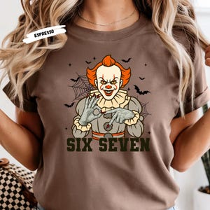 Get ready for spooky laughs and horror-movie vibes with our Six Seven Horror Character Tees 👻 — the perfect mash-up of scary and funny! This exclusive collection features your favorite classic villains — Freddy Krueger, Michael Myers, Jason Voorhees, Chucky, and Pennywise the Clown — each throwing up the Six Seven hand sign for a hilarious twist on iconic slashers.
