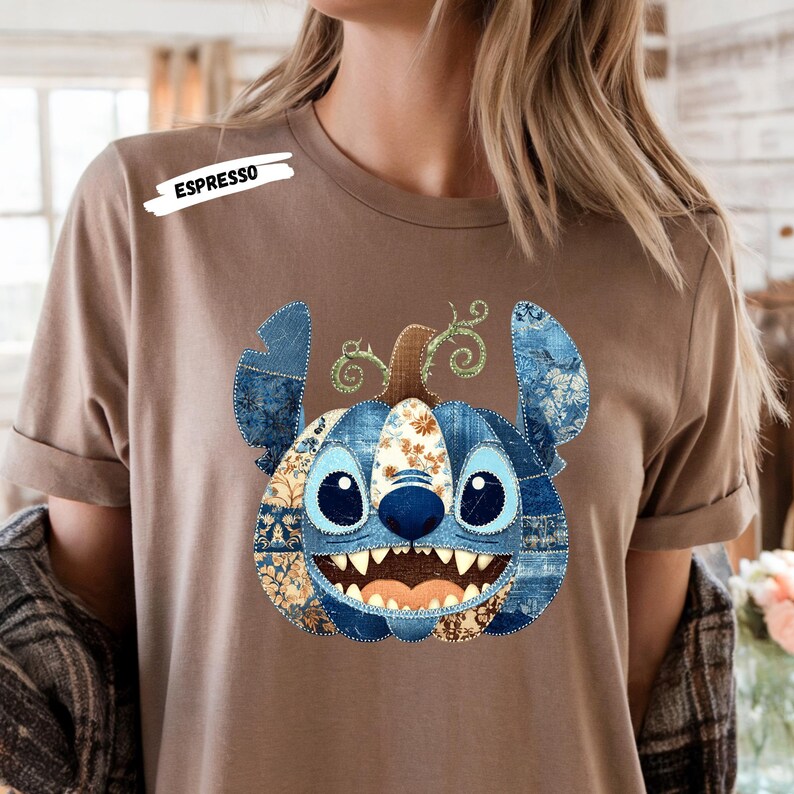 🎃 Cozy Disney Halloween Sweatshirt – Patchwork Stitch Pumpkin Pullover
Celebrate spooky season in magical style with this adorable Stitch pumpkin sweatshirt, featuring a patchwork pumpkin design in rich denim and floral patterns. Perfect for Disney Halloween outfits, fall trips to the parks, or cozy autumn nights. This unisex crewneck makes the ultimate gift for Disney lovers, pumpkin spice fans, and anyone who loves cute and spooky fashion. Soft, comfortable, and perfect for Halloween parties