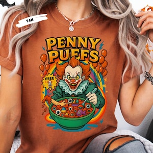 Start your spooky season with a killer crunch! 🎃 This Horror Cereal Halloween Shirt mashes up your favorite scary movie icons with classic breakfast cereal box art. Featuring creepy characters like Chucky, Freddy Krueger, Pennywise, Michael Myers, zombies, and more — this funny and nostalgic design is perfect for Halloween parties, horror fans, or anyone who loves a little spooky fun. Ideal for group costumes or themed October outings!
