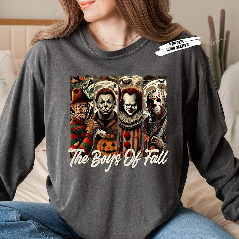 Get ready for spooky season with this “The Boys of Fall” horror movie shirt featuring four of the most iconic scary movie villains — Freddy Krueger, Michael Myers, Pennywise, and Jason Voorhees 🔪🎈. Perfect for horror fans, this graphic tee combines creepy Halloween vibes with fall colors, making it a must-have for scary movie marathons, haunted houses, and October nights. Soft, comfortable, and ideal for any horror lover’s fall wardrobe.