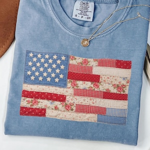 Comfort Colors blue jean t-shirt with retro faux patchwork American flag design in red white and blue vintage style perfect for 4th of July patriotic outfit.