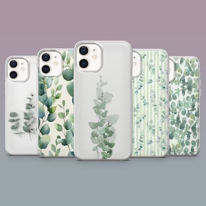 May include: Five phone cases showcasing eucalyptus leaf designs. The cases have clear, white, and patterned backgrounds with green and white eucalyptus leaves. Designs include vertical stripes, scattered leaves, and a central stem.