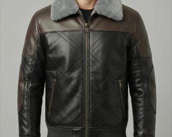 May include: A two-tone leather jacket with a gray shearling collar and cuffs. The jacket features brown and black panels with a quilted diamond pattern. It has a zip-up front and two side pockets. The jacket is a bomber style.