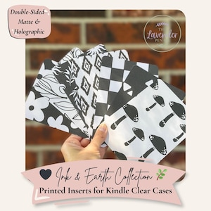 May include: A hand holds a stack of black and white printed inserts for Kindle clear cases. The inserts feature various patterns, including flowers, geometric shapes, and mushrooms. The text reads "Ink & Earth Collection" and "Printed Inserts for Kindle Clear Cases."