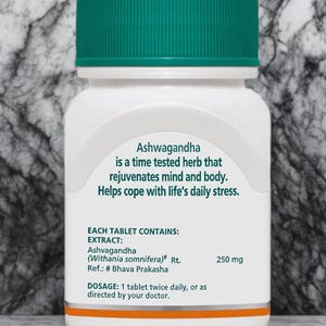 May include: A white bottle with a green cap containing Ashwagandha tablets. The label states the herb rejuvenates mind and body and helps with stress. Each tablet contains 250 mg of Ashwagandha extract.
