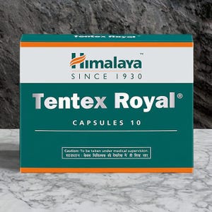 Puede incluir: Una caja rectangular de cápsulas Himalaya Tentex Royal. La caja es de color verde azulado, blanco y naranja, con el nombre de la marca y del producto bien visibles. También se ve el texto "CAPSULES 10".
