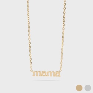 May include: A gold necklace featuring the word "mama" in lowercase letters. The chain is fine and the pendant is a simple, elegant design. The necklace is shown against a light background. A stylish piece of jewellery.