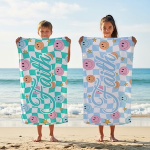 May include: Two beach towels with a checkered pattern, smiley faces, and stars. One towel is teal and white, the other is light blue and white. The word "Faith" is written in a cursive font on each towel.