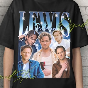 May include: Black unisex t-shirt featuring a collage of images of Lewis Pullman with the name "LEWIS" in a blue and white font. The words "Unisex T-Shirt" are in yellow at the top.