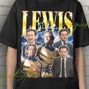 May include: Black unisex t-shirt featuring a graphic of the actor Lewis Pullman with the word "LEWIS" in gold lettering. The design includes multiple images of the actor. The words "Unisex T-Shirt" are in yellow at the top.