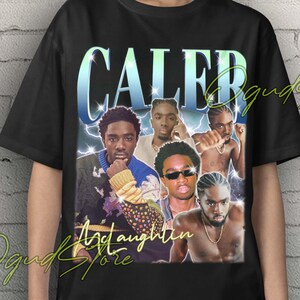 May include: Black unisex t-shirt with a graphic of the word "CALEB" in a blue and green gradient font, and images of several men. The shirt also has the text "And aughten" and "Ogud Store". The words "Unisex T-Shirt" are at the top.
