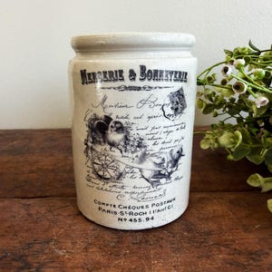 May include: A rustic wooden sign with the text "Welcome to our home" in a handwritten style. The sign features a distressed finish and a simple, inviting design, perfect for a front porch or entryway.