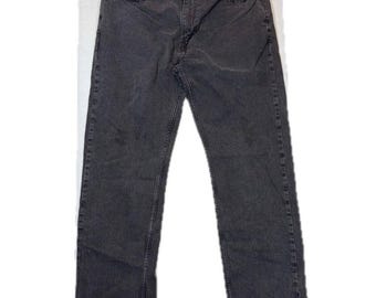 May include: A pair of charcoal gray denim jeans featuring a classic five-pocket design, a button fly closure, and belt loops. The jeans have a straight-leg cut with visible stitching along the seams and a faded wash throughout the fabric.