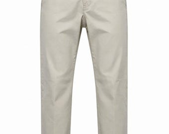 May include: Beige chino pants featuring a button and zipper fly closure, belt loops, two side pockets, and a straight-leg cut. The interior waistband is lined with a light blue fabric, and a small brand label is visible at the back.