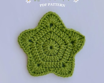 May include: A handmade, green, star-shaped crochet coaster. The coaster is made of yarn and has a textured surface. The text "Little Loop Coasters PDF Pattern" is at the top of the image.