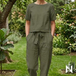 May include: A set of three ceramic mugs with a speckled, matte finish. The mugs are in shades of cream, light gray, and dark gray. Each mug has a simple, minimalist design, perfect for coffee or tea.