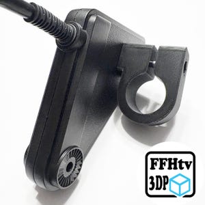 May include: A black, 3D-printed device with a circular mounting ring and a textured surface. A black cable extends from the device. The logo "FFHtv 3DP" is in the lower right corner.