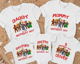 May include: White t-shirts with red text and cartoon character graphics. The shirts read "Daddy", "Mommy", "Brother", "Sister", and "5 Birthday Boy Oliver" with "of the Birthday Boy" below. Family birthday apparel.