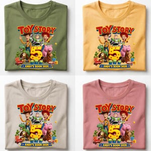 May include: Four t-shirts in olive, yellow, beige, and dusty pink, each featuring a Toy Story graphic with characters, a large yellow number 5, and the text "TOY STORY" and "ANDY'S ROOM 2026" printed on the front of the crew neck garments.