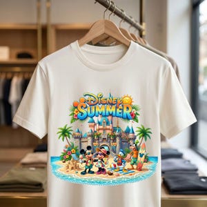 May include: A cream-colored short-sleeve t-shirt featuring a colorful graphic of Disney characters at a beach with a castle. The text reads Disney SUMMER. The design includes Mickey Mouse, Minnie Mouse, Donald Duck, and Goofy with palm trees.
