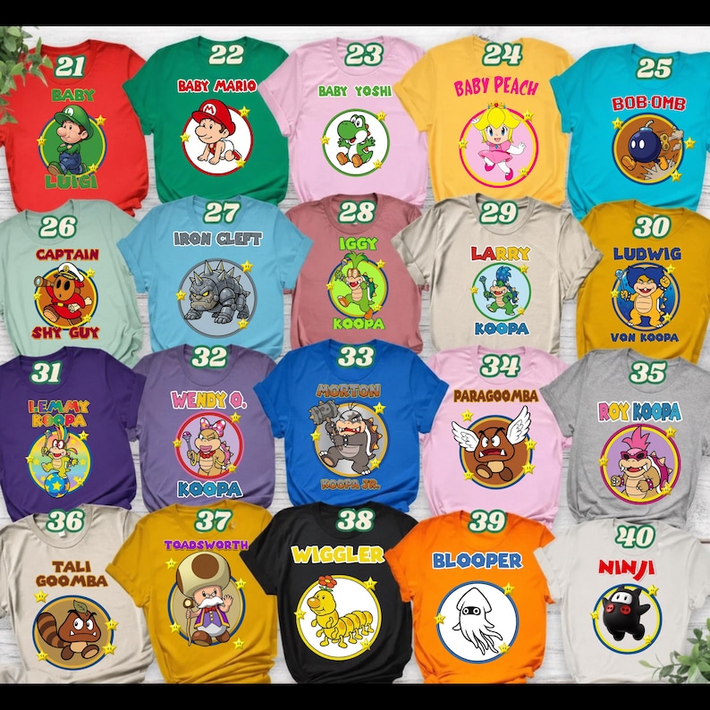 May include: A collection of twenty t-shirts in various colors, each featuring a circular graphic of a Nintendo character with their name printed above or below. The shirts are numbered 21 through 40, displaying characters like Baby Mario, Yoshi, Peach, and various Koopalings.