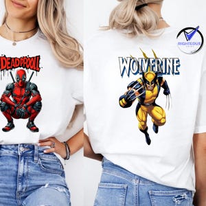 May include: Two white t-shirts featuring comic book characters. One shirt displays Deadpool in a red and black suit with the word "DEADPOOL" above. The other shirt shows Wolverine in a yellow and blue costume with the name "WOLVERINE".
